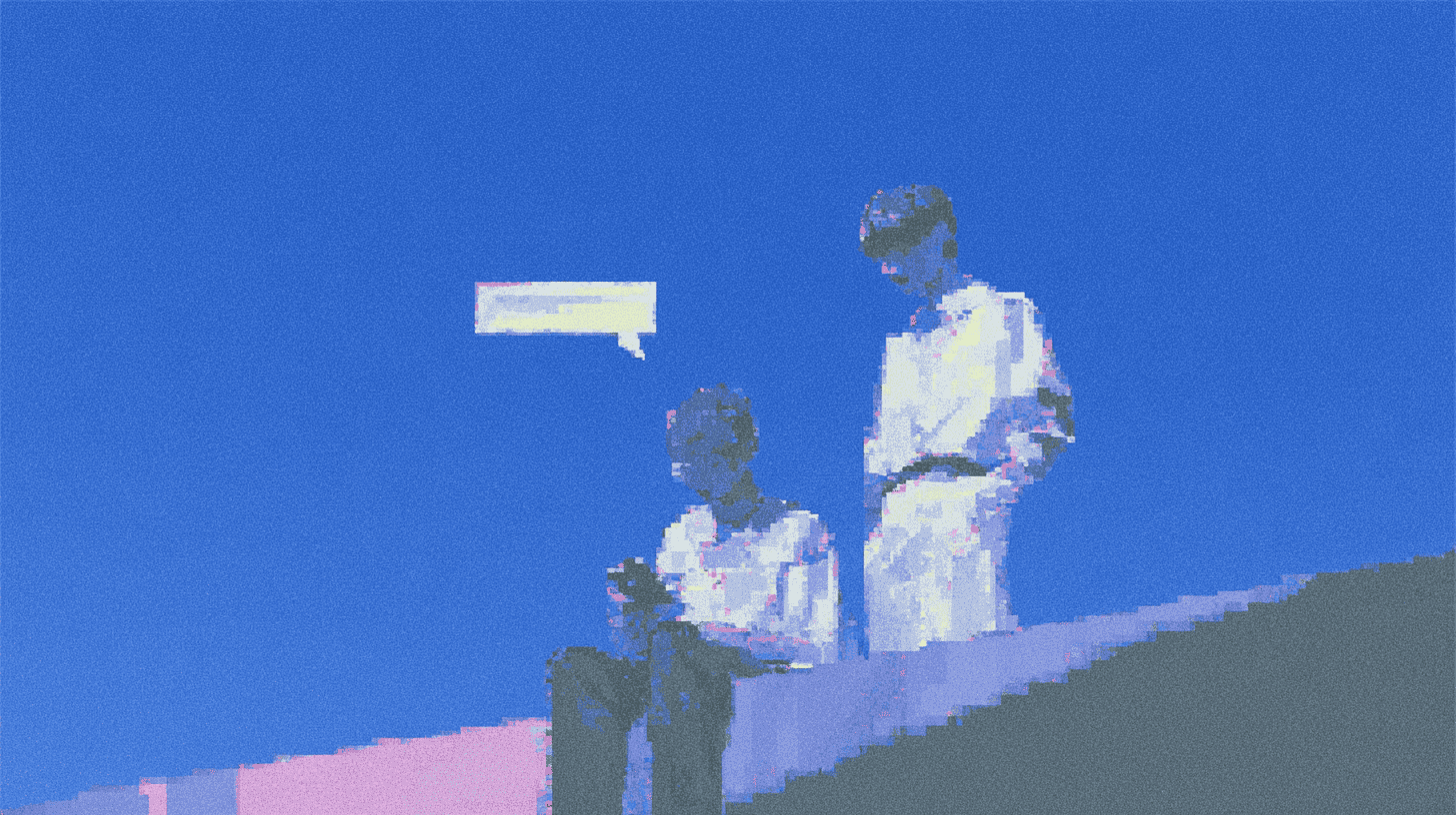 Two people paused on steps, suggesting conversation or waiting.