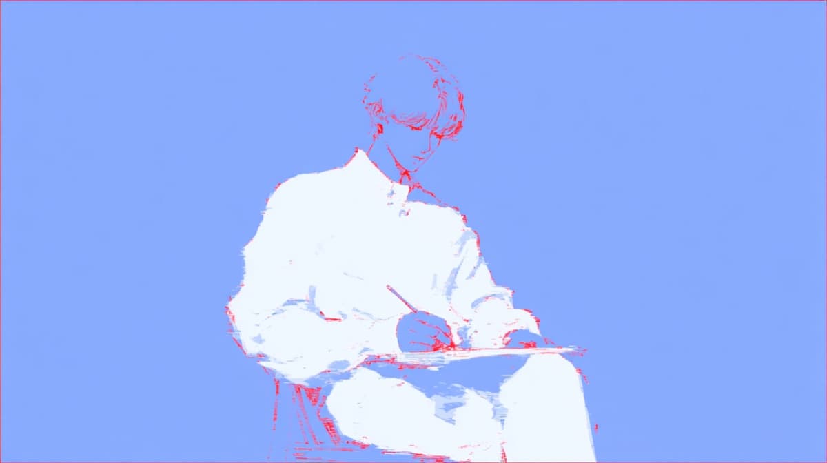 Una persona escribiendo en una libreta